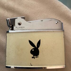 Highly collectible rare Playboy Cream and Silver Lighter